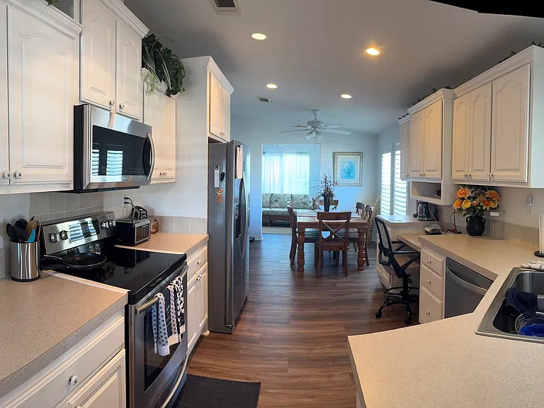 Home has a fantastic Kitchen with loads of cabinets, countertop space and all the appliances including a dishwasher.