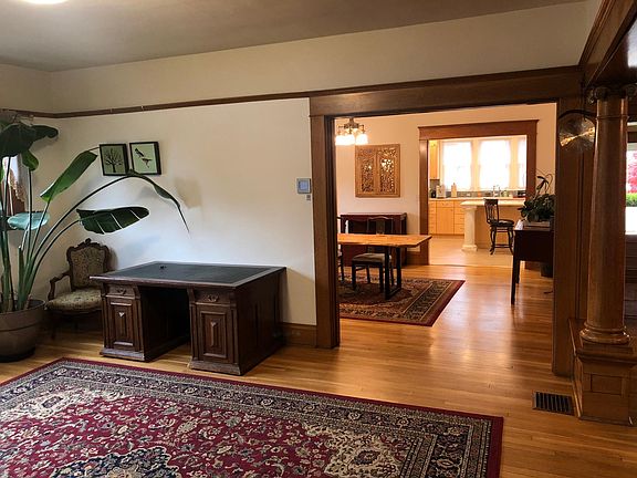 Downstairs living space is open, airy and bright! There is a 58" TV Smart TV on this table in the living room.