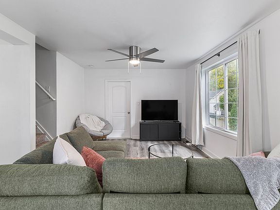 Living room view with TV. Everything included except circle lounge chair.