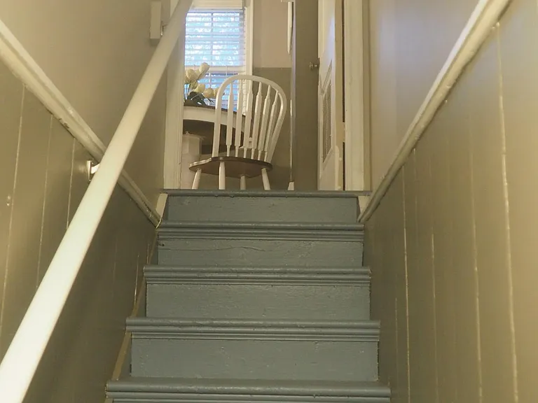 Looking up to dining area from basement