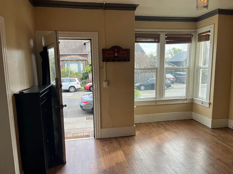 Bay Windows in living room, and Front door from inside