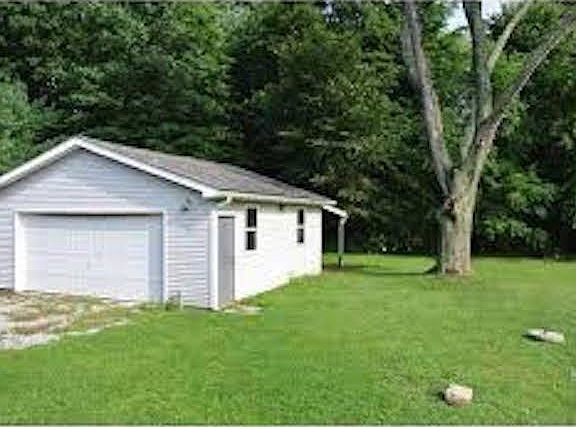 Garage with Hanging Patio Area