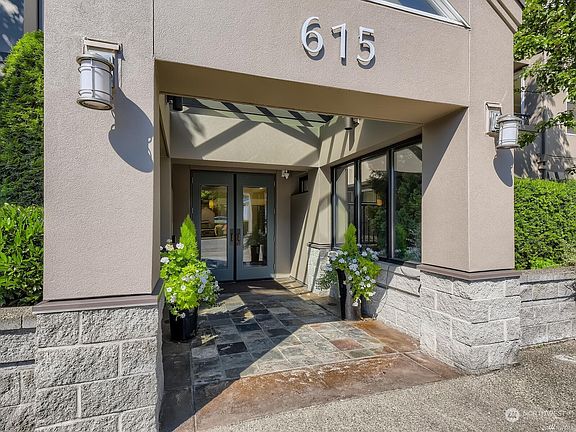 Covered exterior entryway with secure entrance includes a welcoming lobby for guests.>