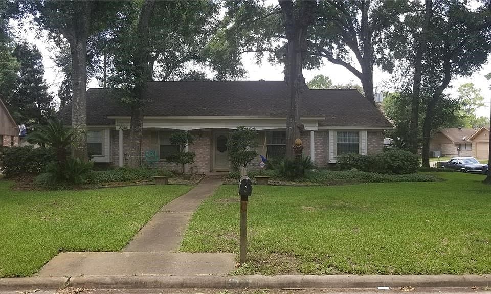 This front view of the Property includes your paved walkway from door-to-mailbox.  Beautiful landscaping with plenty of room in your Candlelight Forest West corner-lot to enjoy fresh air under the shade of Texas Cedars