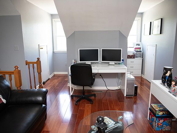 Loft in master bedroom. There are three storage areas. Two of the doors can be seen to the left and right of the windows. The third is inside the center column.