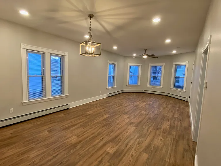 Dining and Living Room with high ceilings and recessed lighting