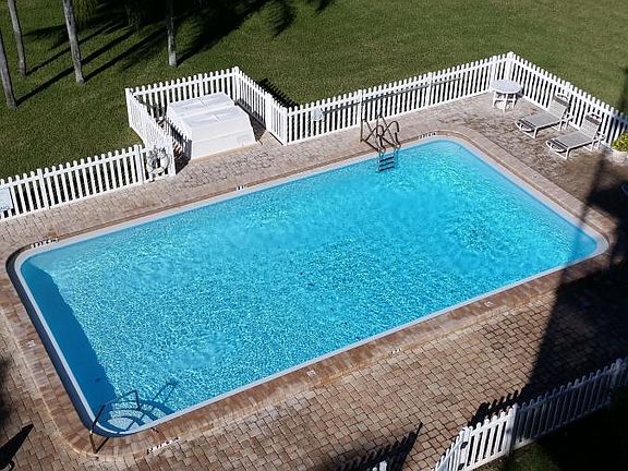 Balcony view of lovely pool area.
