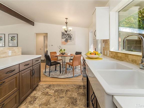 Updated kitchen with newer cabinet and countertop.