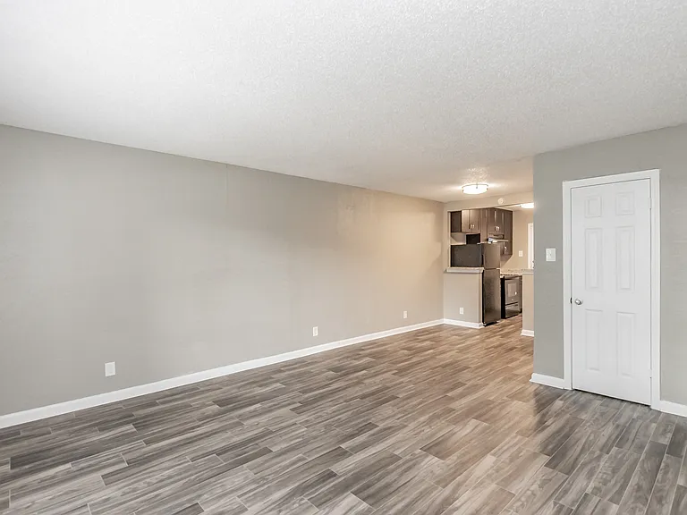 Enjoy cooking in stylish kitchens with dark cabinetry and granite-style counters at Chapel Creek Apartments.