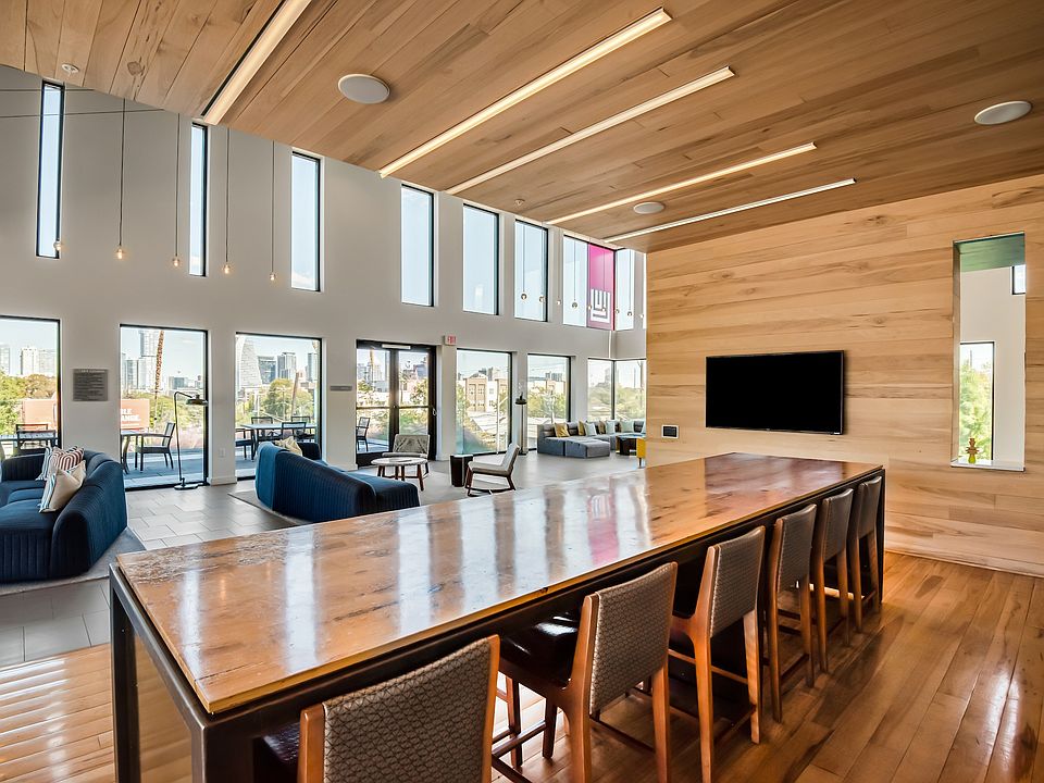 Lounge with TV Wall, Natural Light, and Comfortable Seating Areas