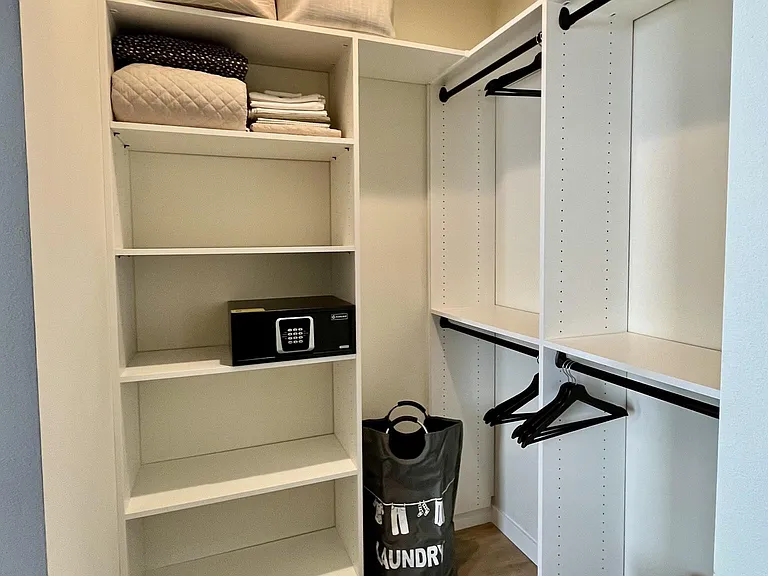 Walk-in closet attached to primary bedroom