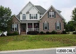 Custom all brick home on level corner lot.