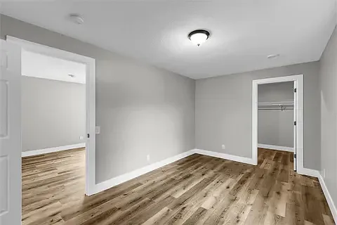 Master bedroom accessible from the living room, includes a walk in closet...