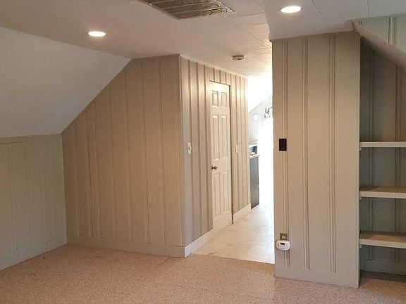 Living room with built in shelving.