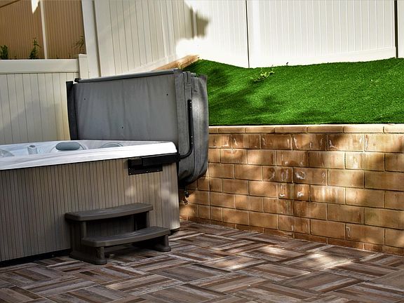 Backyard; jacuzzi included.