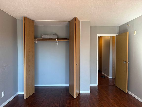 Main bedroom cupboards, looking towards the apartment front door.