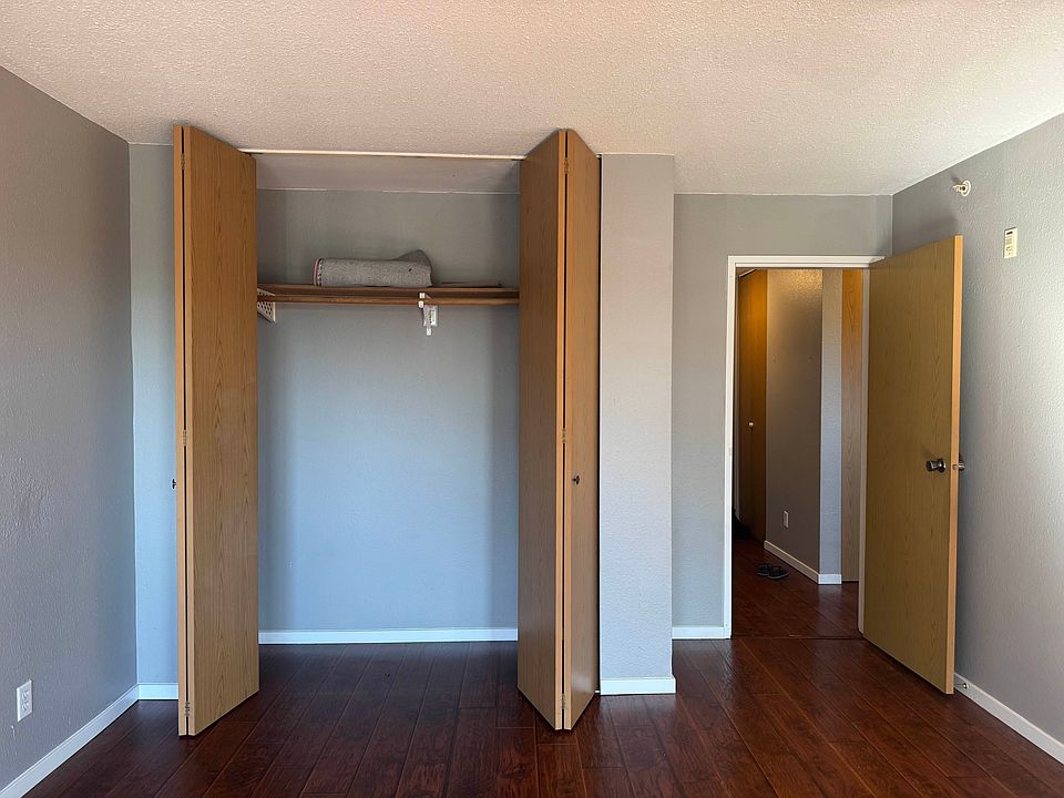 Main bedroom cupboards, looking towards the apartment front door.