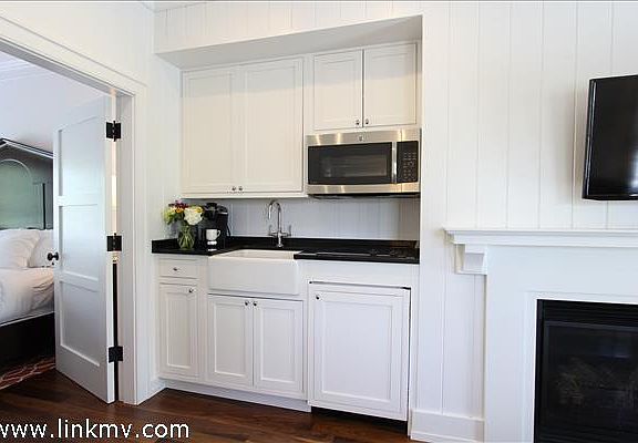 Kitchenette with Convection Microwave Oven, Two Burner Cooktop and Sub Zero Fridge/Freezer
