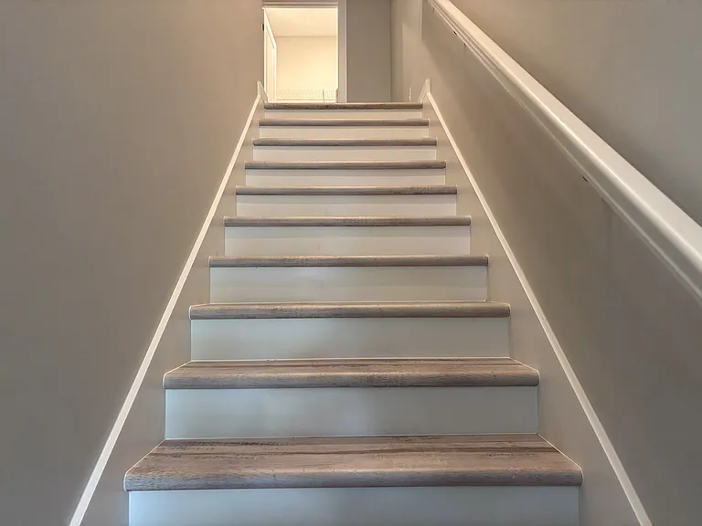 Staircase up to upper bedrooms, Linen closet and Laundry room