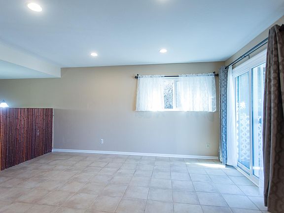 Family room and sliding door to front balcony