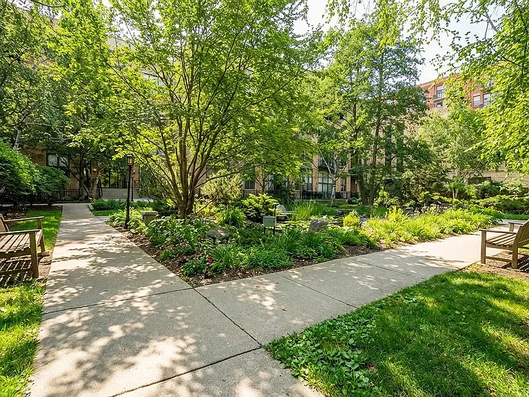 Enjoy the coveted tranquil Block Y courtyard with walking path, benches and serene koi pond