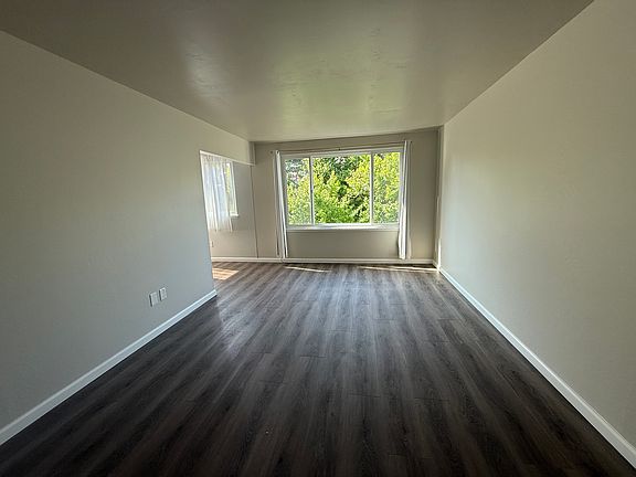 Large and bright living room area with open closet area