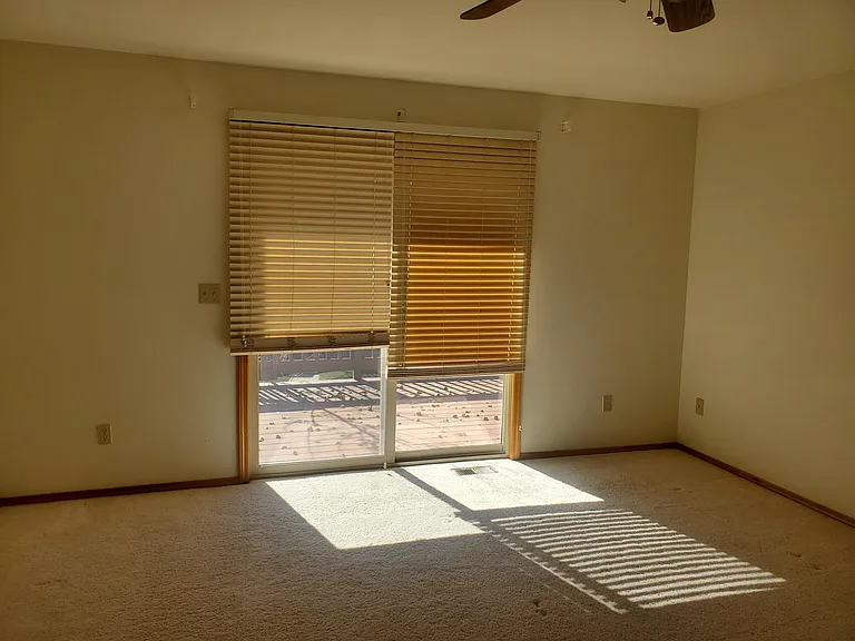 Master bedroom with walk out to upper deck