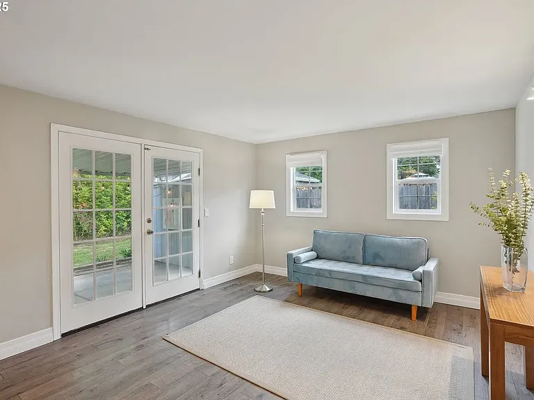 French doors lead to walk-out patio and gardens