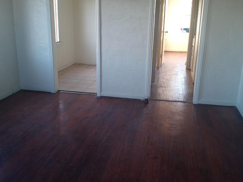 Living Room view into hall and Kitchen