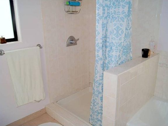full bath with tub and shower upstairs