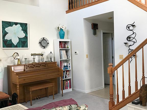 Front living room. Lots of bright natural light, two-story ceiling
