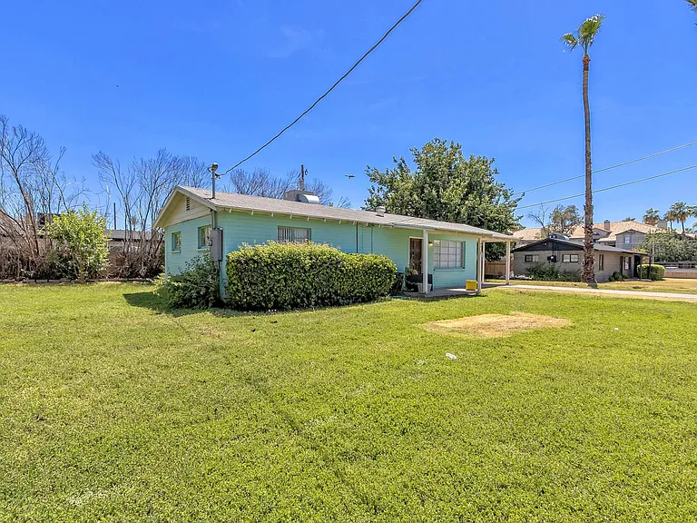 Lush green side and front yard