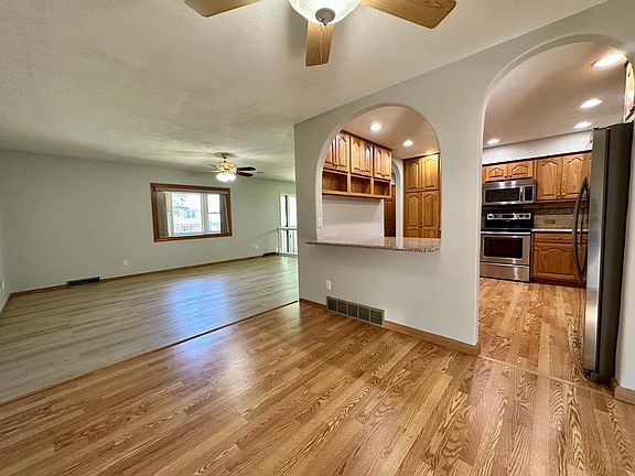 Dining area connected to the kitchen with a large bar. New luxury floor throughout the house - see another picture