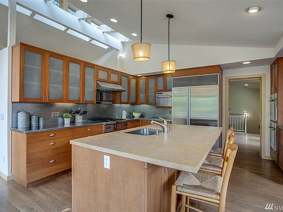 Oak hardwood floors, custom cherry cabinets and marble and stainless countertops.
