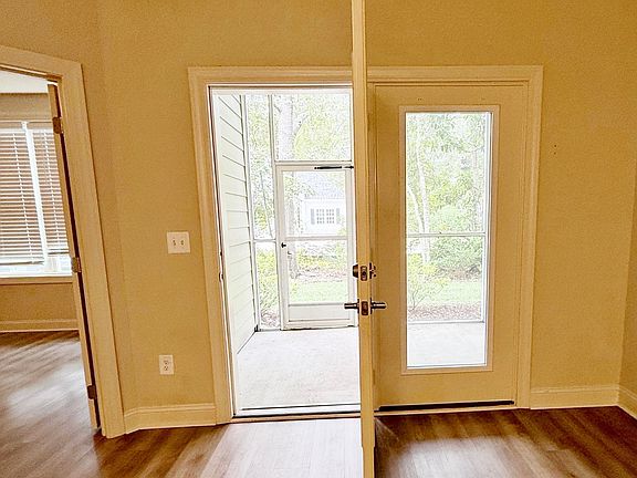 Screened back porch with exit.