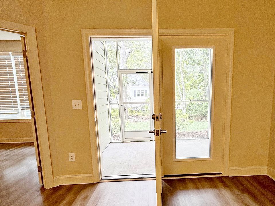 Screened back porch with exit.