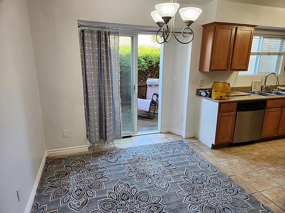 Dining area off kitchen and leading to patio.