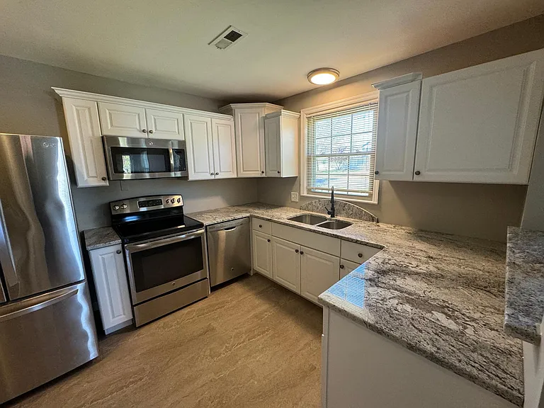 Stainless Frig, Stove, Dishwasher, & Microwave