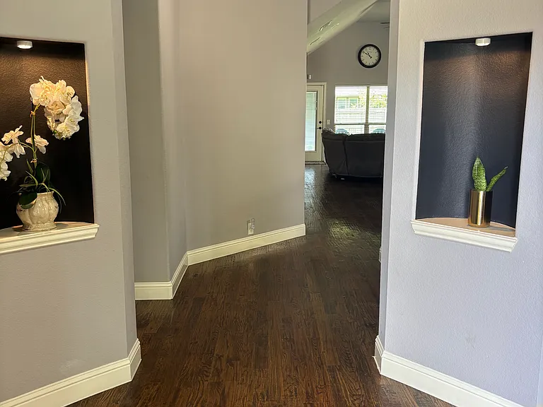Welcoming front entryway filled with character and showcasing beautiful wood flooring