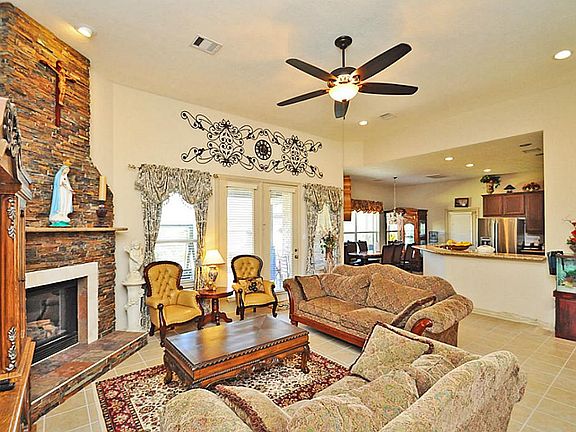 DEN accommodates multiple furniture arrangements. High ceilings...