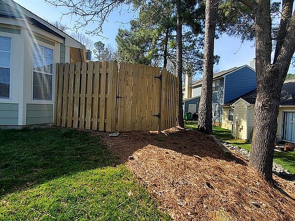 Back of home with patio