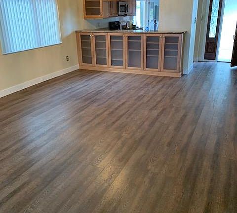Family room with dining area - note abundant storage cabinets.