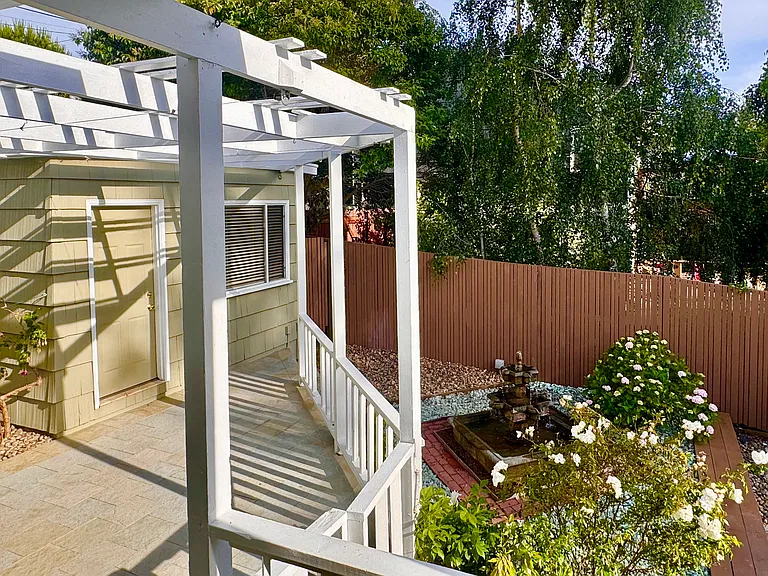 The pleasant splashing sounds of the large Spanish fountain, roses, hydrangas and mature white birch trees create a haven of outdoor peace.