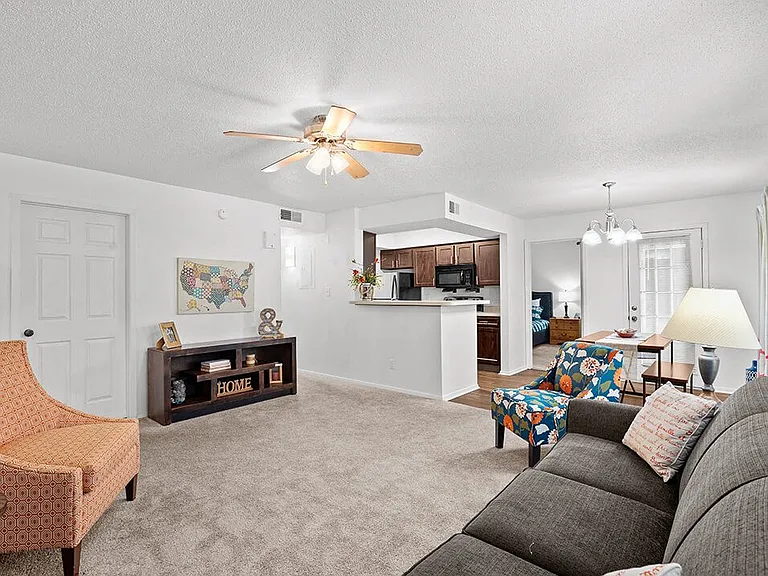 Carpeted Living Room with Ceiling Fan