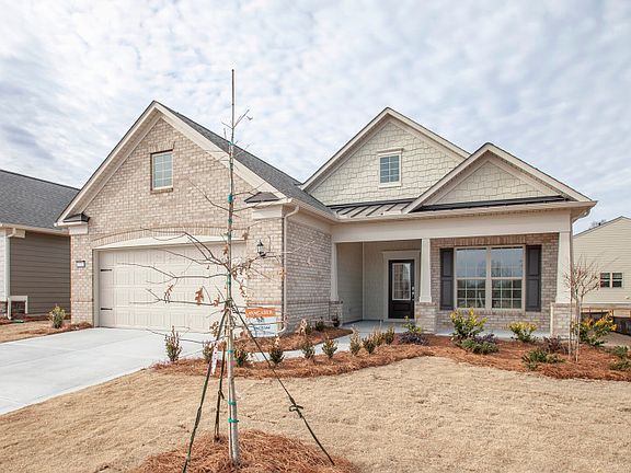 Castle Rock Exterior 8 features brick, shakes and covered front porch