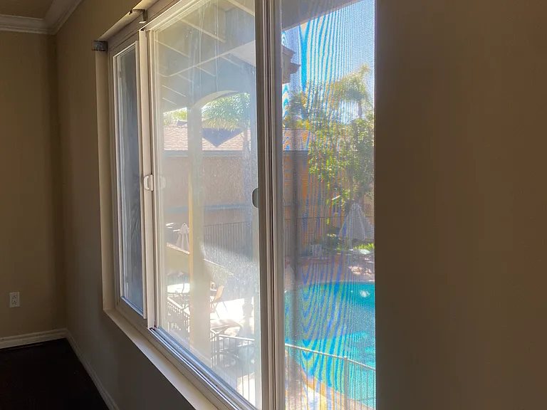 Living Room Window with View of Pool