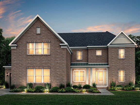 Sutton Exterior 11 features brick, covered front porch and 3 car sideload garage