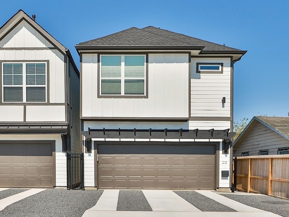 Sleek townhouses in Independence Heights feature minimalist design, gabled roofs, and elegant garage