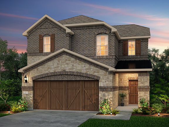 The Nelson, a two-story home with 2-car garage, shown with Home Exterior N
