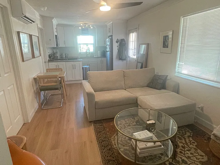 Shows full length of living room to the kitchen in the back. Taken from door to front porch/office.